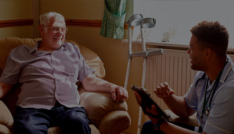 Sitting elderly man chatting to the doctor