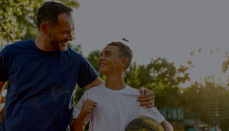 Playing a basketball with his father