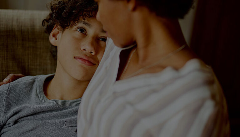 A boy glanced up at his mother