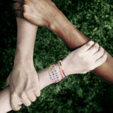 Three arms interlocked with each other